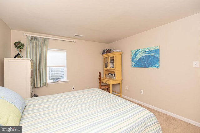 bedroom featuring light colored carpet