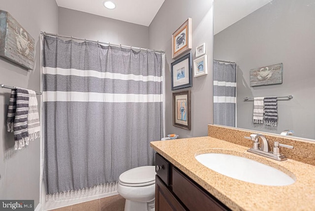 bathroom with tile patterned flooring, vanity, toilet, and a shower with shower curtain