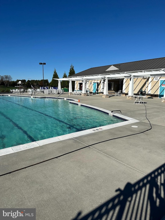 view of pool featuring a patio area