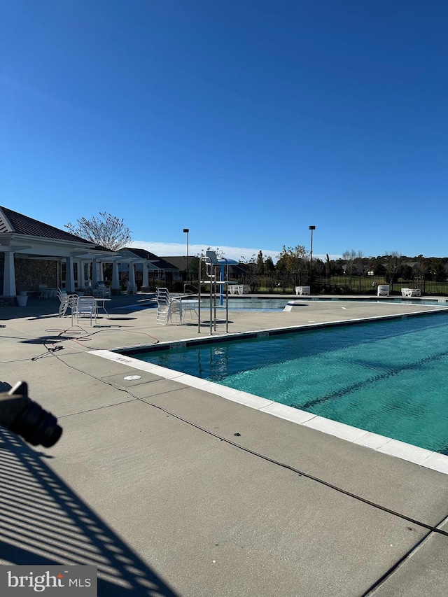 view of pool featuring a patio area