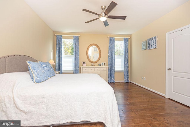 bedroom with ceiling fan and dark hardwood / wood-style flooring