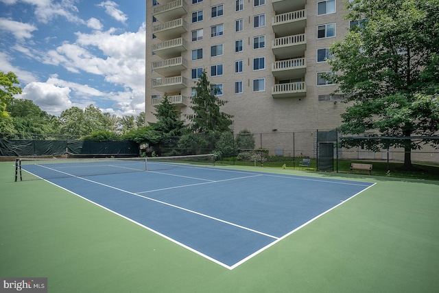 view of sport court featuring basketball hoop