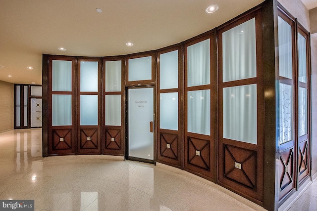 entryway with recessed lighting and baseboards