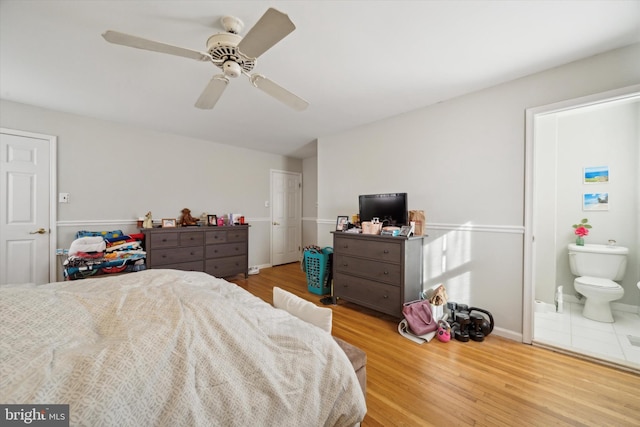 bedroom with hardwood / wood-style flooring, ceiling fan, and ensuite bathroom