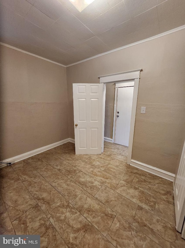 spare room with ornamental molding