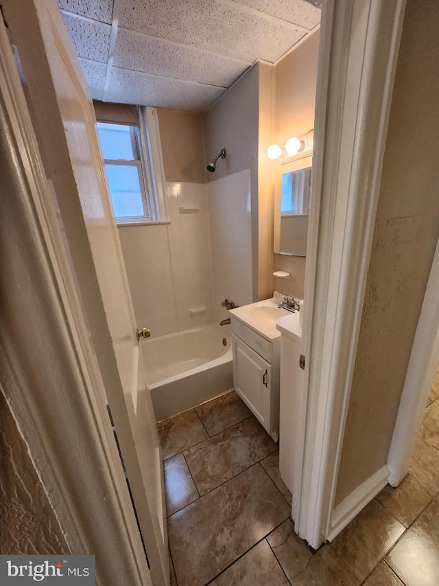 bathroom with shower / tub combination, vanity, and tile patterned flooring