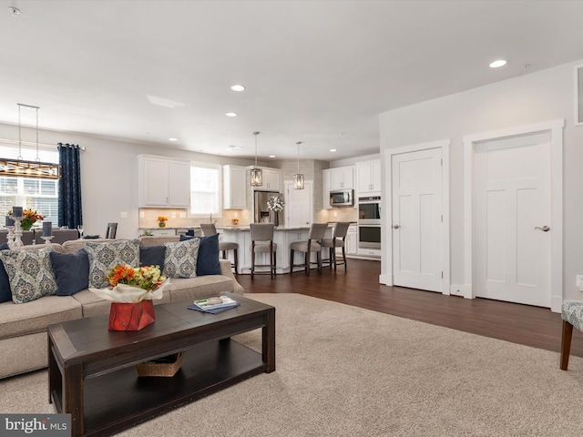 living room with dark hardwood / wood-style floors