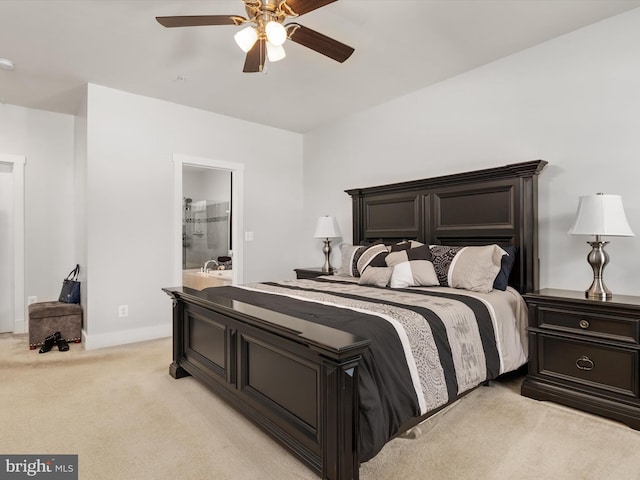 carpeted bedroom with ceiling fan and connected bathroom