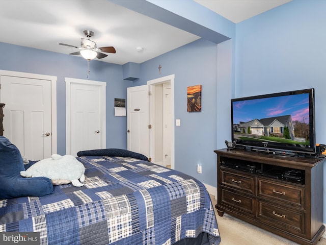 bedroom with light colored carpet and ceiling fan