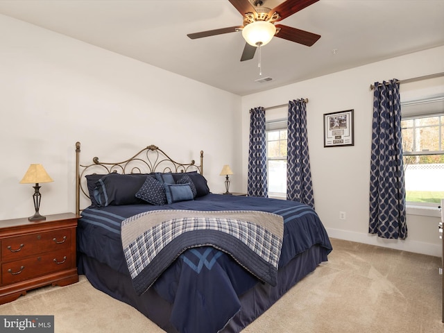 carpeted bedroom with ceiling fan