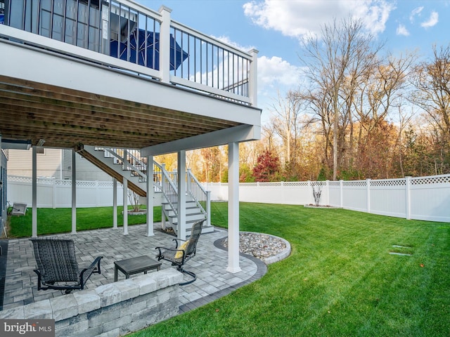 view of yard featuring a patio and a deck