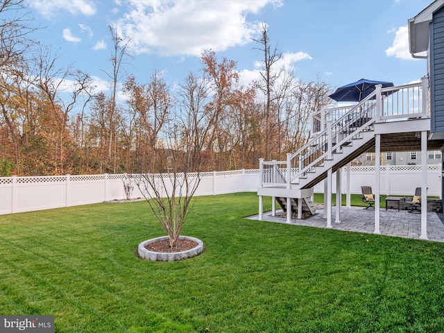 view of yard with a patio and a deck