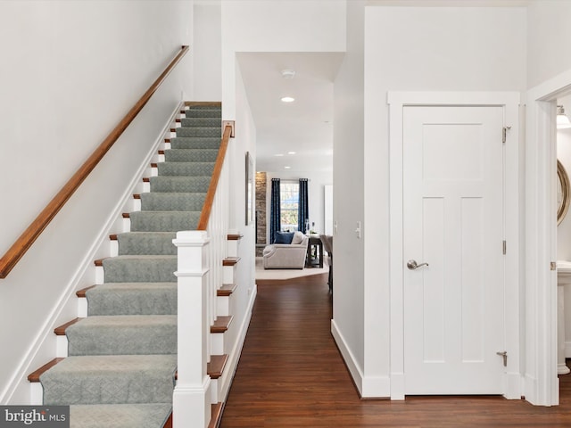 stairway featuring hardwood / wood-style flooring