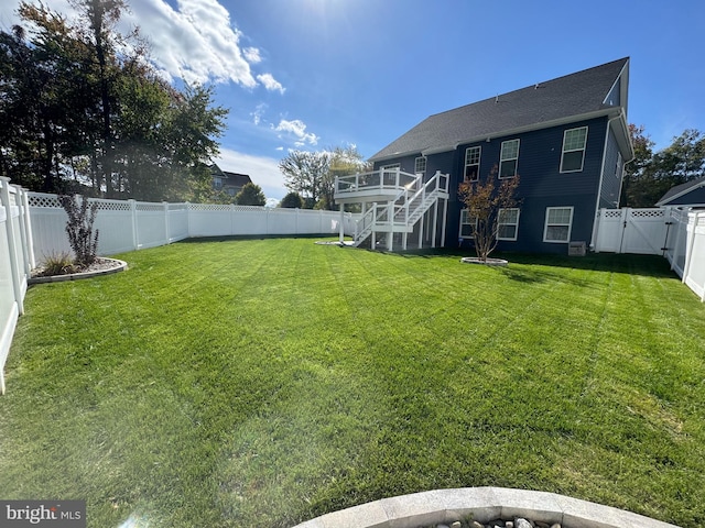 view of yard featuring a wooden deck