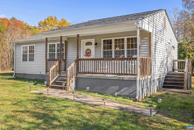 bungalow with a front lawn and a porch