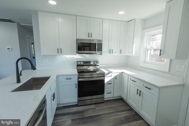 122 Roselawn Rd, Annapolis, MD 21403 - kitchen featuring stainless steel appliances, white cabinets, recessed lighting, and light countertops