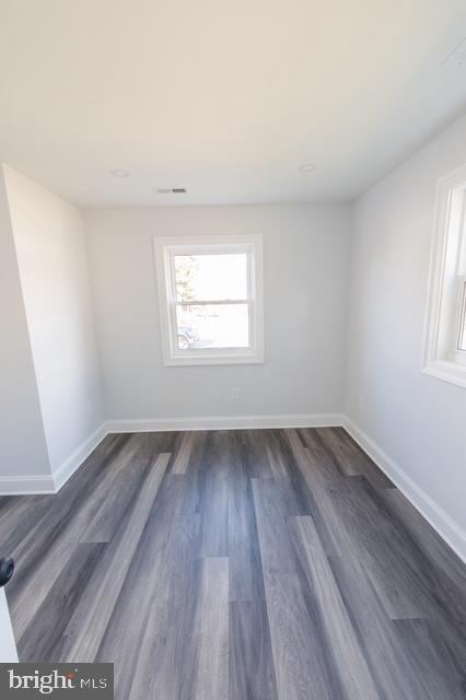 empty room featuring dark hardwood / wood-style floors