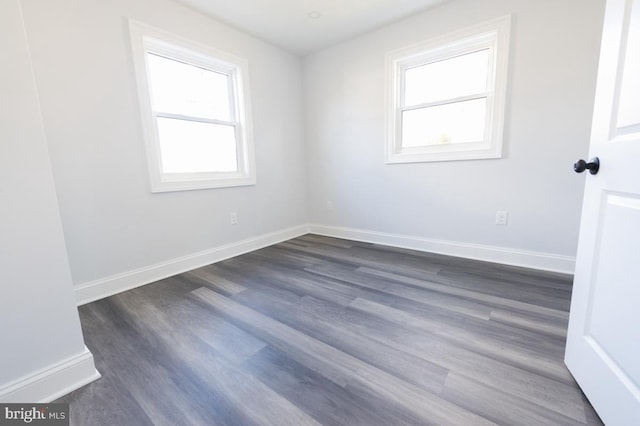 empty room with dark hardwood / wood-style floors