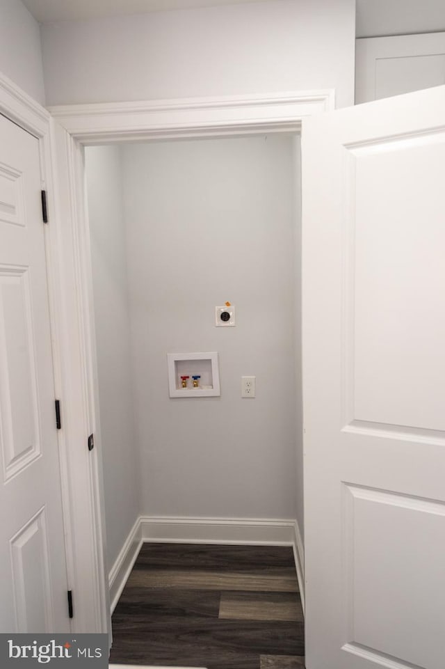 laundry area featuring hookup for an electric dryer, dark hardwood / wood-style flooring, and washer hookup