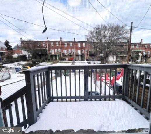 view of snow covered deck