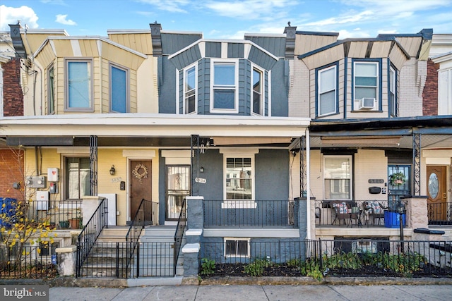 multi unit property with cooling unit and a porch