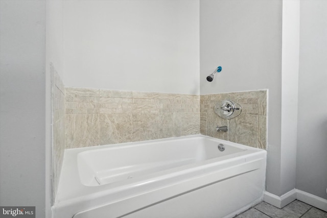 bathroom featuring tile patterned flooring and a bathing tub