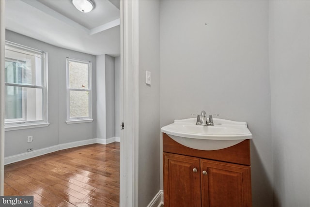 bathroom featuring vanity and wood-type flooring