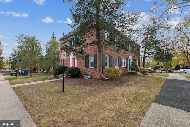 view of home's exterior with a yard