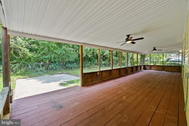 wooden terrace featuring a patio and ceiling fan