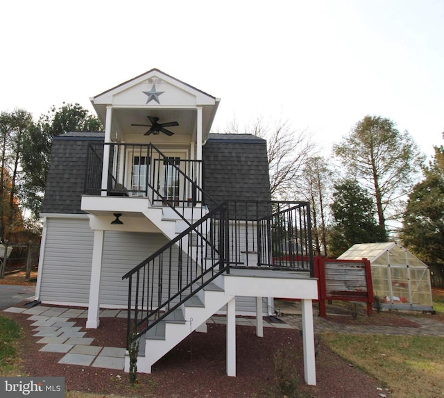 exterior space with an outbuilding and ceiling fan