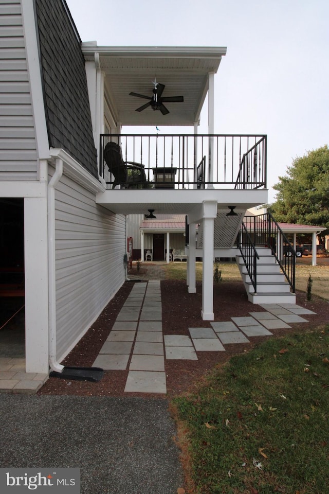 exterior space with ceiling fan