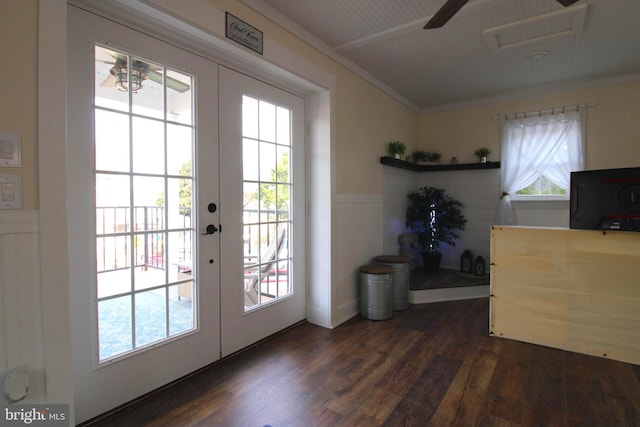 doorway with dark hardwood / wood-style flooring, a wealth of natural light, and french doors