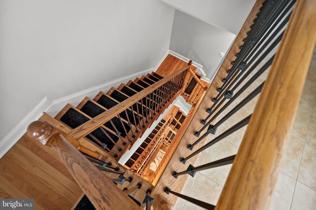 staircase with tile patterned flooring