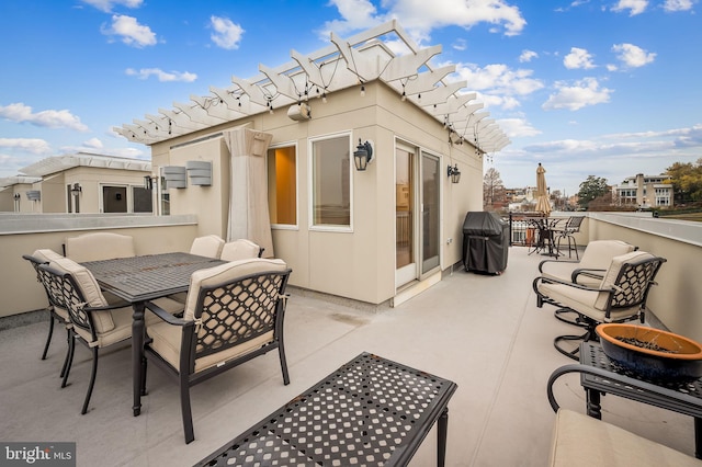 view of patio / terrace with grilling area and a pergola