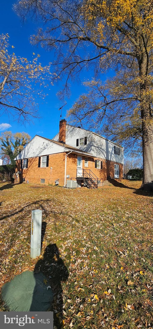 view of side of home featuring a lawn