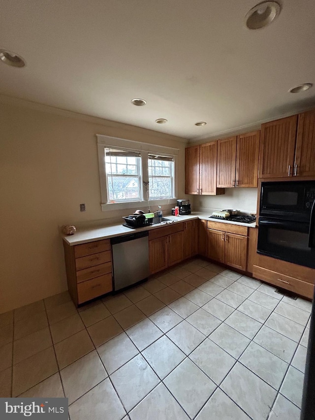 kitchen with black appliances and light tile patterned floors