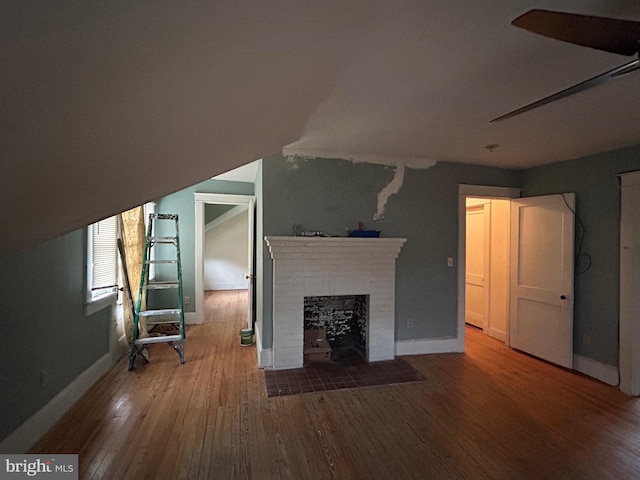 unfurnished living room featuring hardwood / wood-style floors and a fireplace