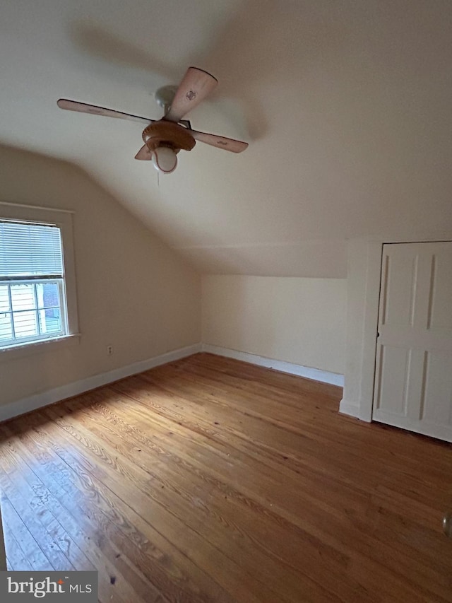 bonus room with ceiling fan, wood-type flooring, and lofted ceiling