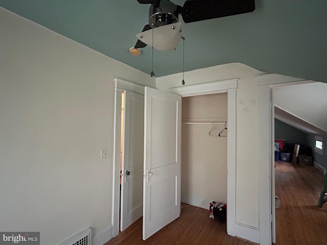 unfurnished bedroom featuring a closet and wood-type flooring