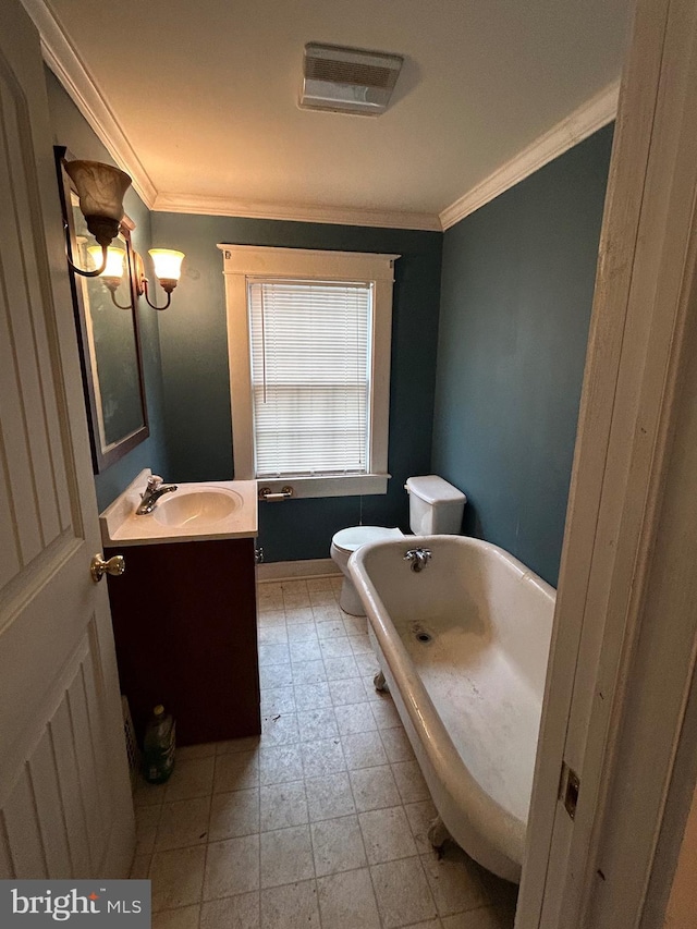 bathroom with vanity, toilet, ornamental molding, and a bath