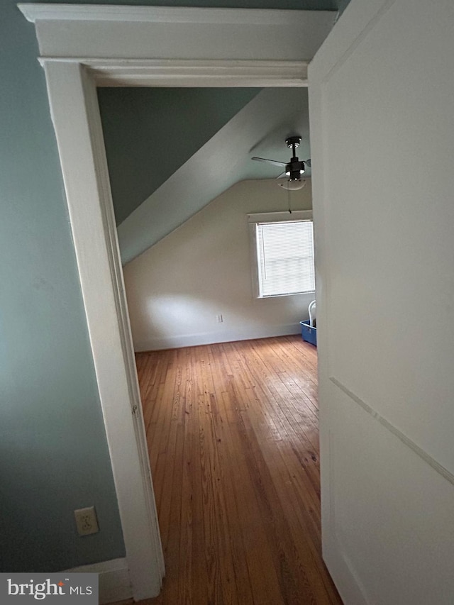 bonus room featuring hardwood / wood-style floors, ceiling fan, and vaulted ceiling