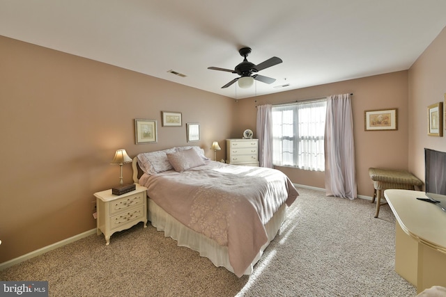 carpeted bedroom with vaulted ceiling and ceiling fan