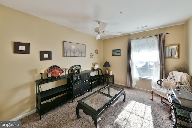 sitting room with carpet flooring and ceiling fan