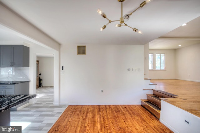 unfurnished living room with light hardwood / wood-style flooring