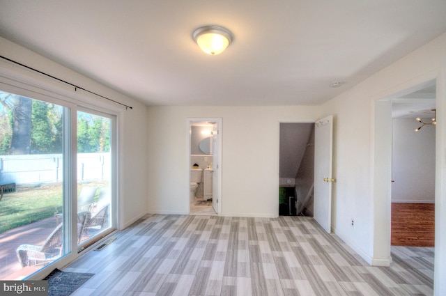 spare room featuring light hardwood / wood-style floors