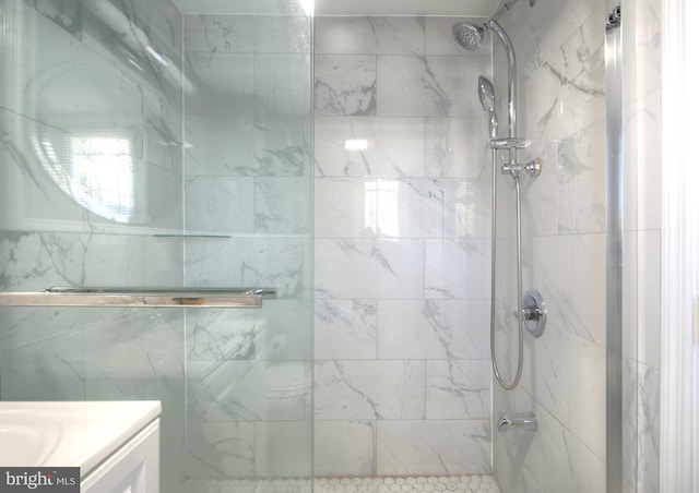 bathroom featuring vanity and a tile shower