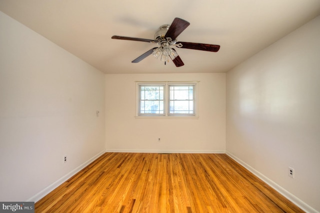 empty room with light wood-type flooring and ceiling fan