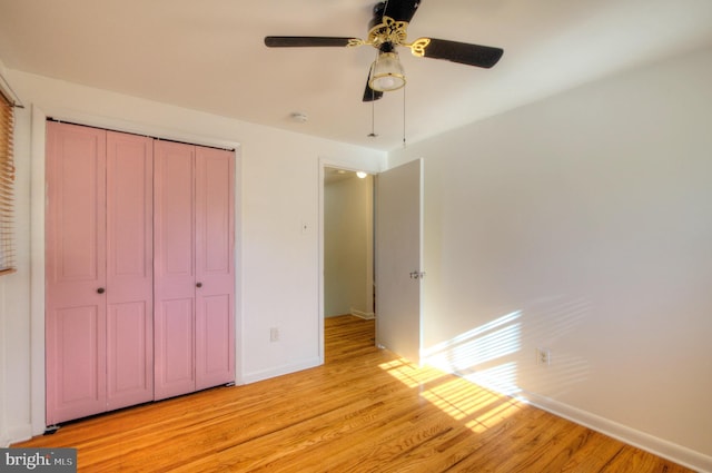 unfurnished bedroom featuring a closet, ceiling fan, and light hardwood / wood-style flooring