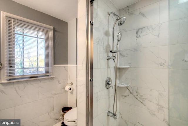 bathroom with walk in shower and toilet