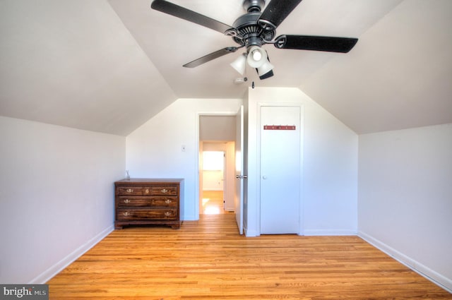 bonus room with light wood-type flooring, lofted ceiling, and ceiling fan